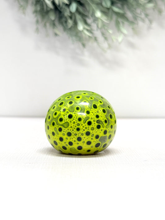 OOZE Ball sensory squeeze toy available in pink, orange, green, and yellow